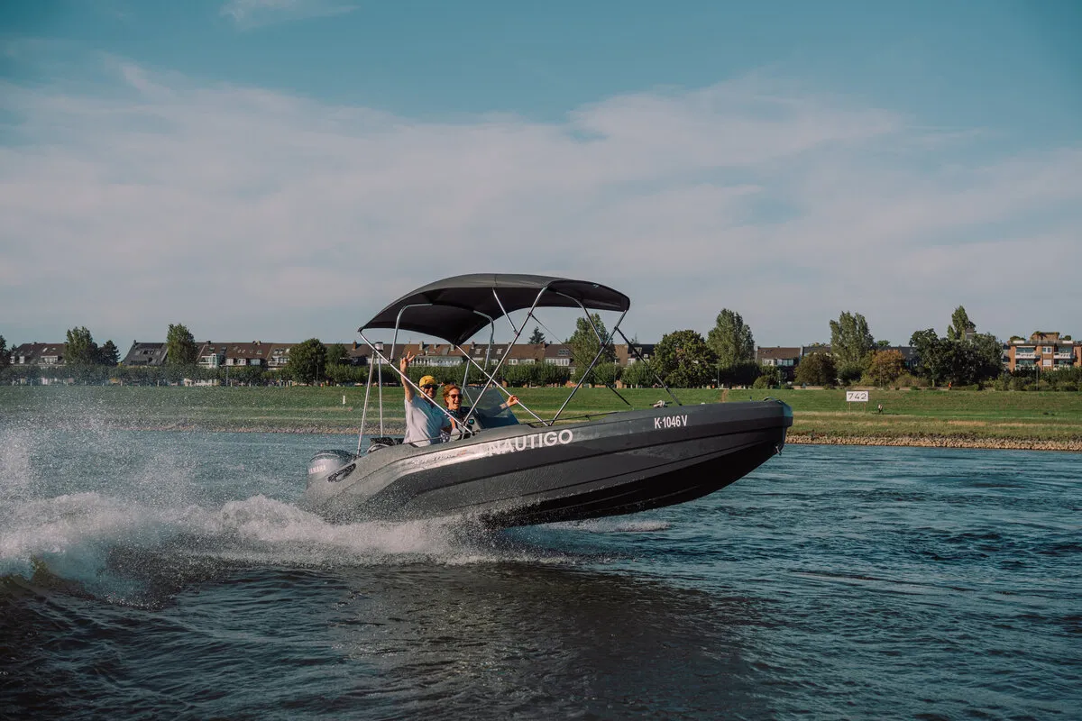 SeaStorm 17 underway on the Rhine with Bimini top