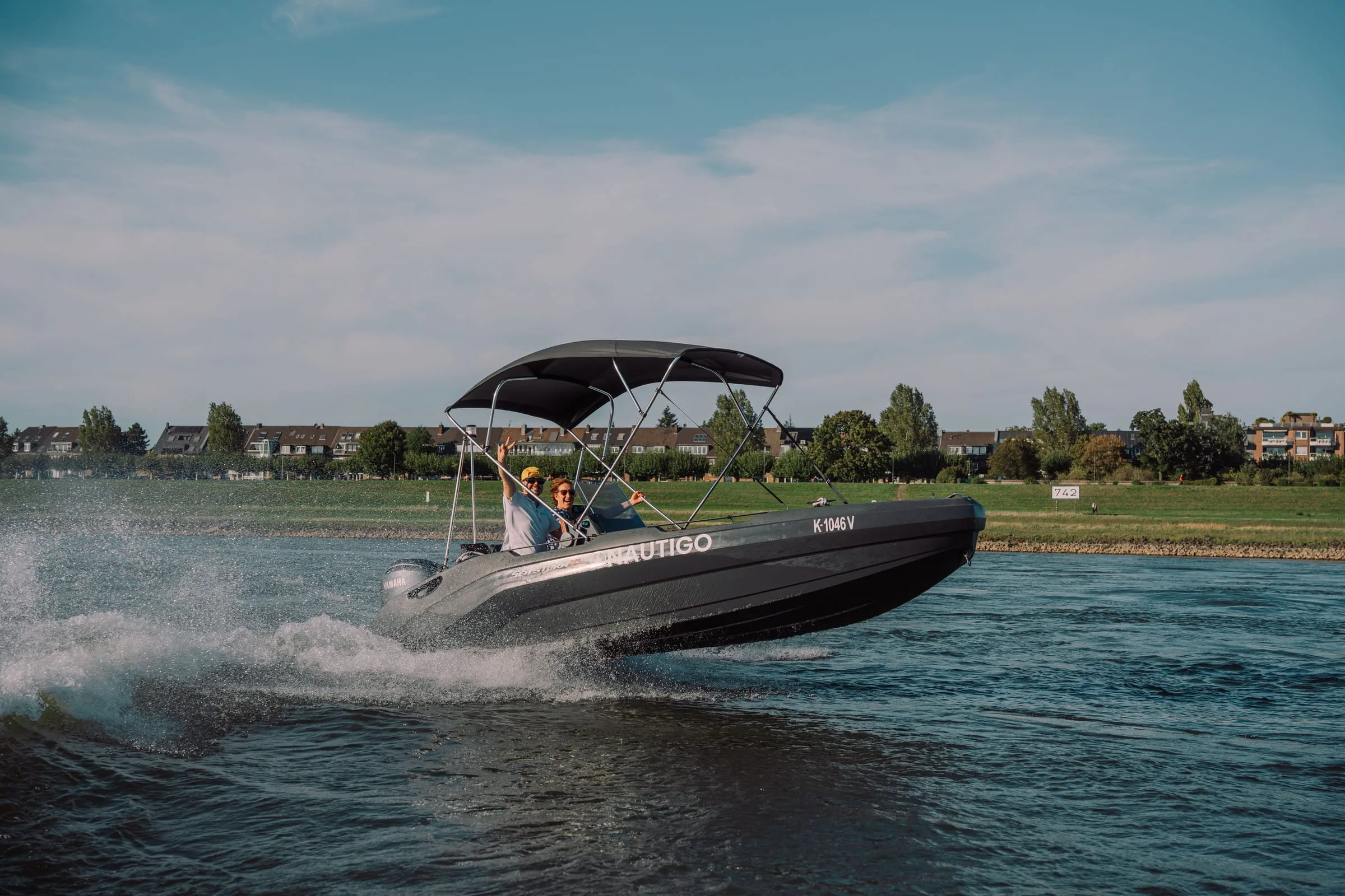 SeaStorm 17 underway on the Rhine with bimini top