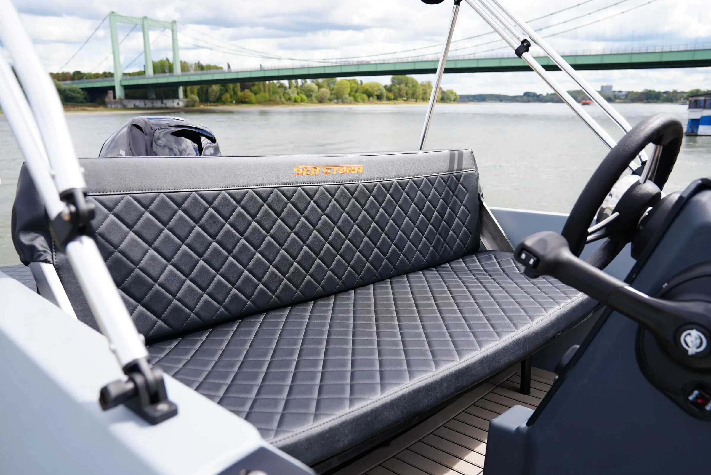 Cockpit of the SeaStorm 13s with helm station and bench seat