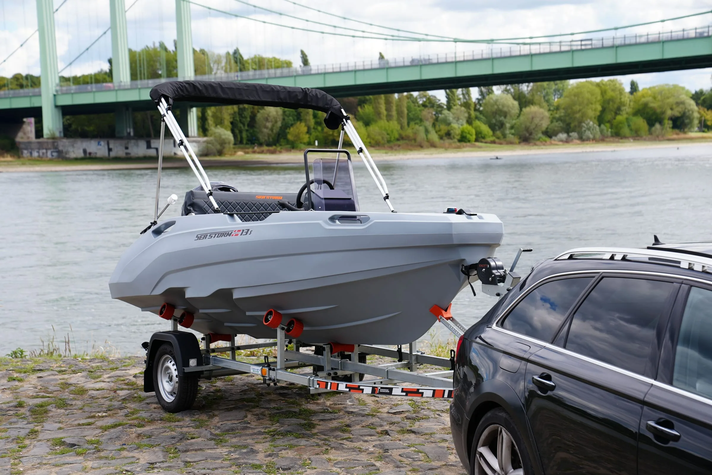 SeaStorm 13s on its trailer by the Rhine below the Rodenkirchen bridge