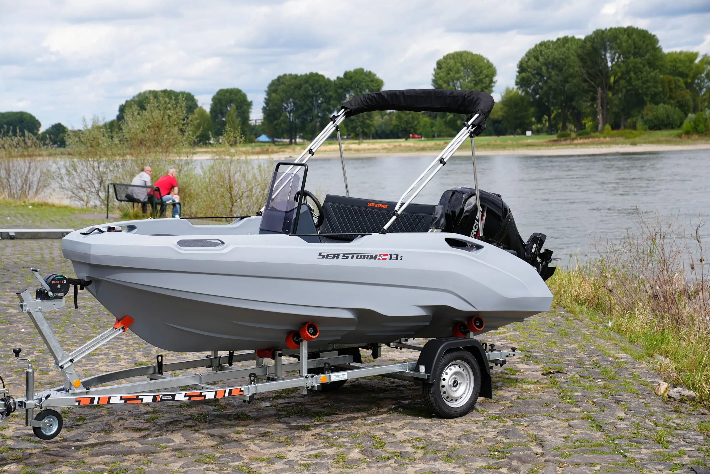 SeaStorm 13s fully rigged on its trailer at the riverside