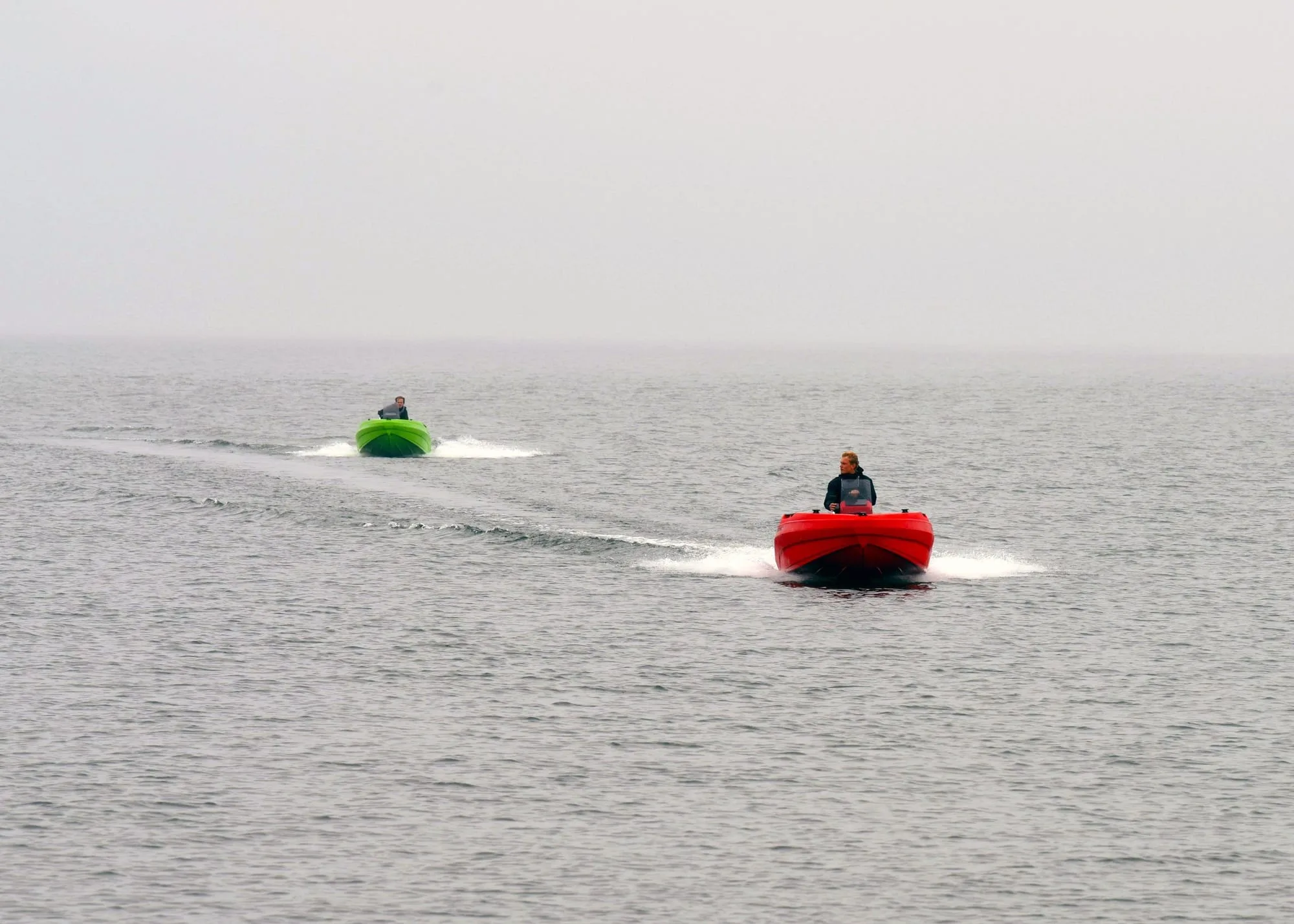 SeaStorm 14 in red and SeaStorm 12 in green underway together