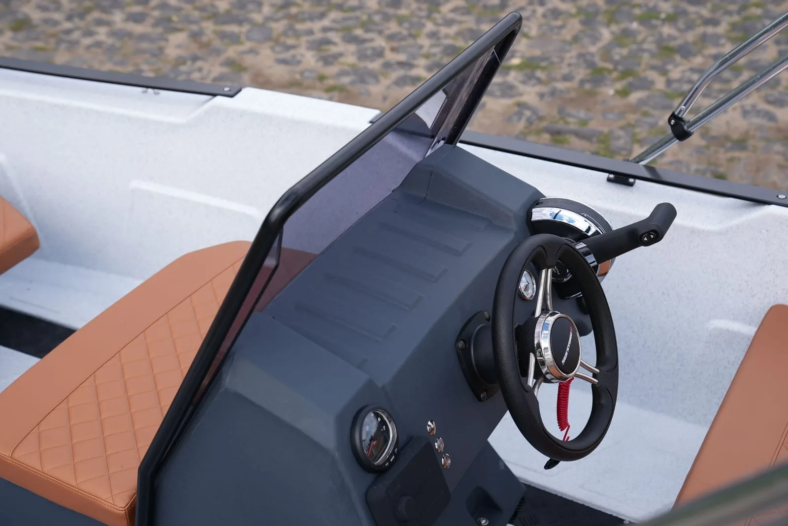Helm station of the SeaStorm 17 with windscreen