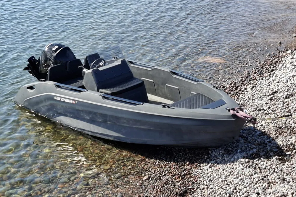 Cleaned HDPE sports boat SeaStorm 17 at a mooring berth in the harbour